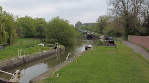 Locks on the Kennet and Avon Canal near Rowde. This is part of the Caen Hill flight of 29 locks. A narrowboat is just leaving heading in the direction of Trowbridge, Bradford on Avon and Bath. Images: Roland Millward