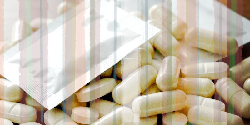 A pile of plain tablets, capsules, and sachets.