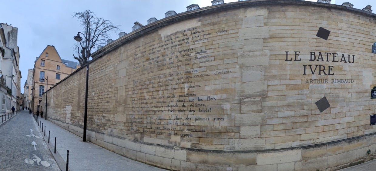 stone wall inscribed with a long poem, in Paris