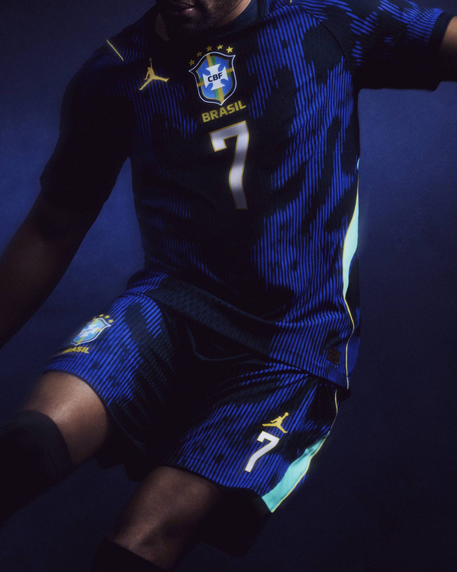A soccer player models Brazil's Jordan Brand away kit.