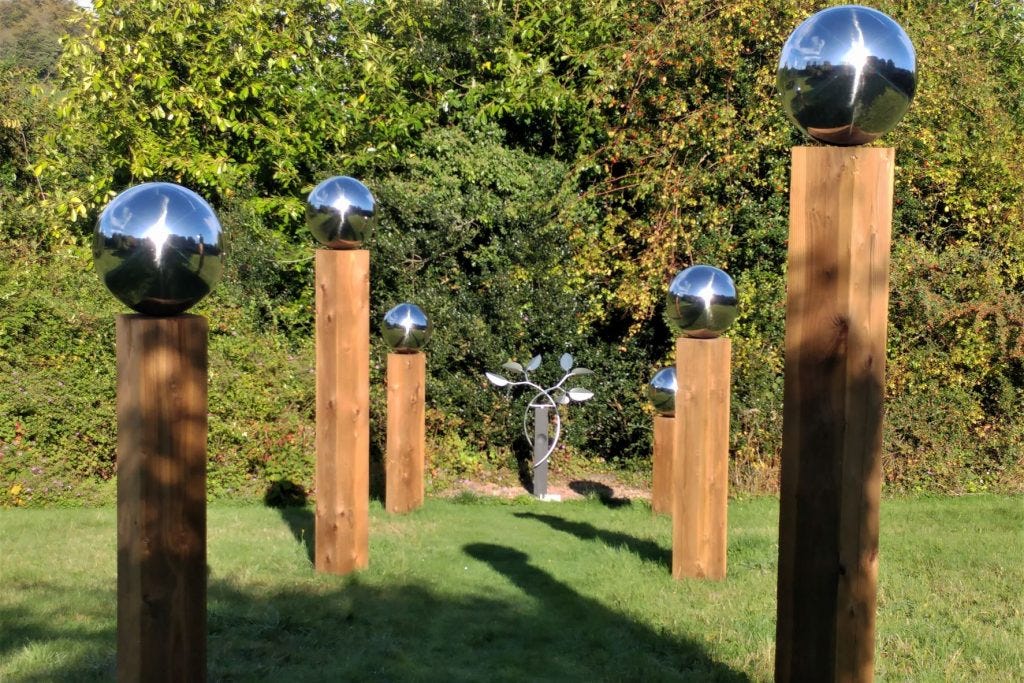 Globes in the meadow at Veddw Garden copyright Anne Wareham 