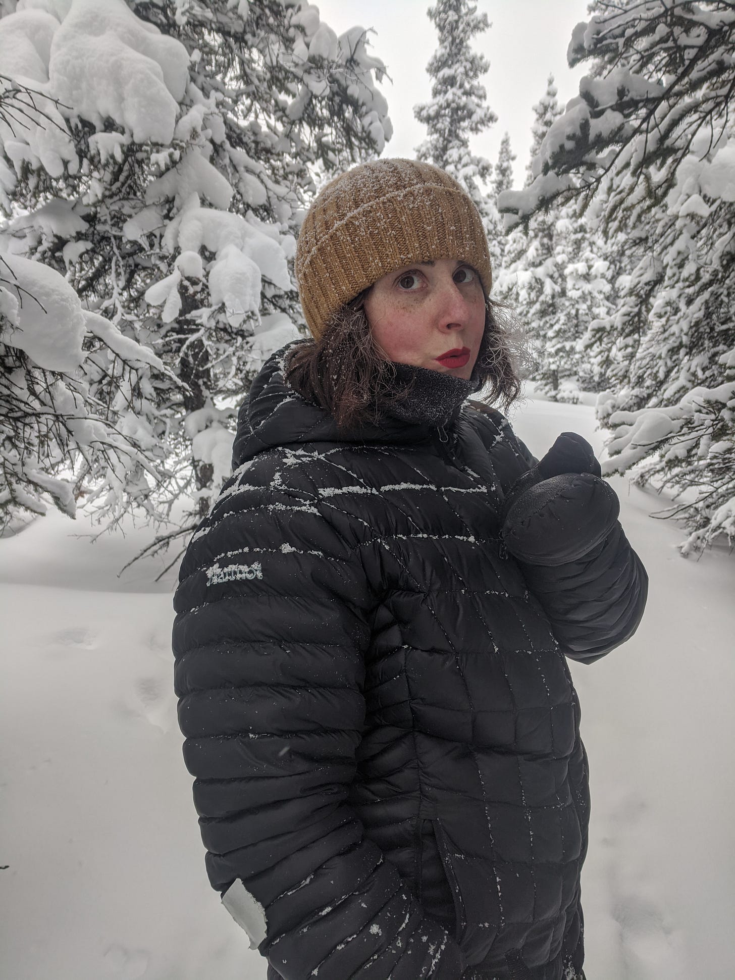 jess blows a kiss in the snow