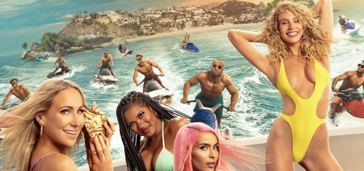women in swimsuits on the beach, with men approaching them from the water on jetskis in the background
