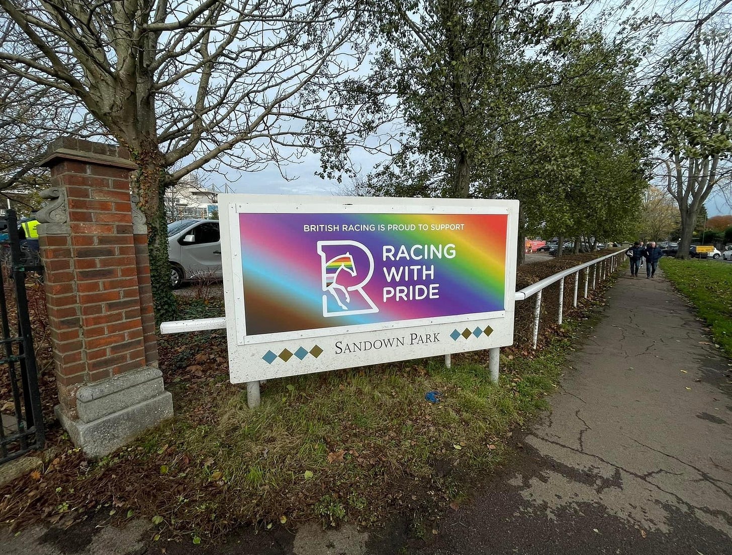 Sandown Racecourse sign stating "Proud to support Racing With Pride" Sandown Racecourse sign stating "Proud to support Racing With Pride"