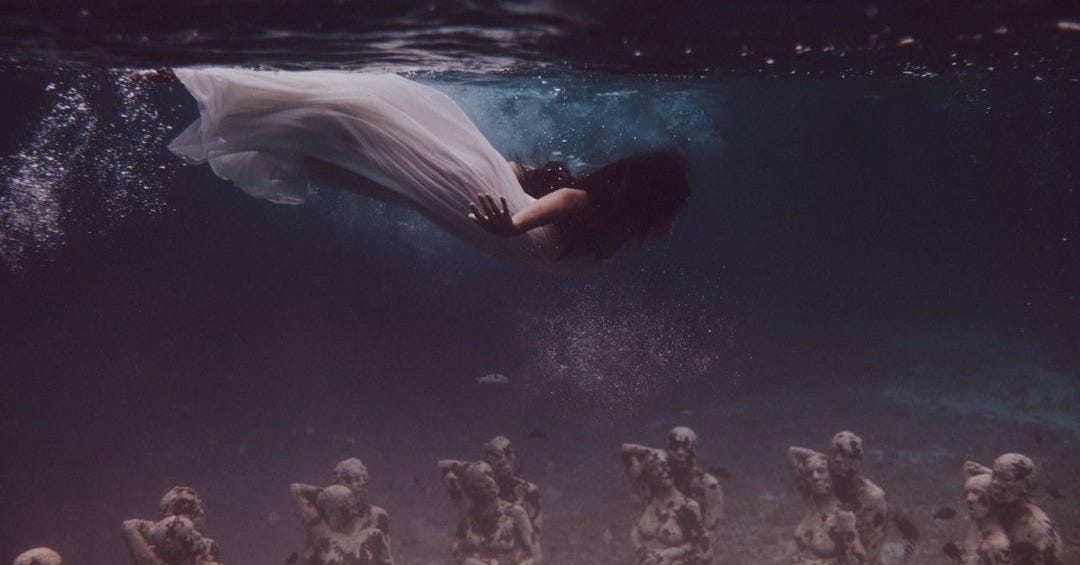 woman in white dress in water