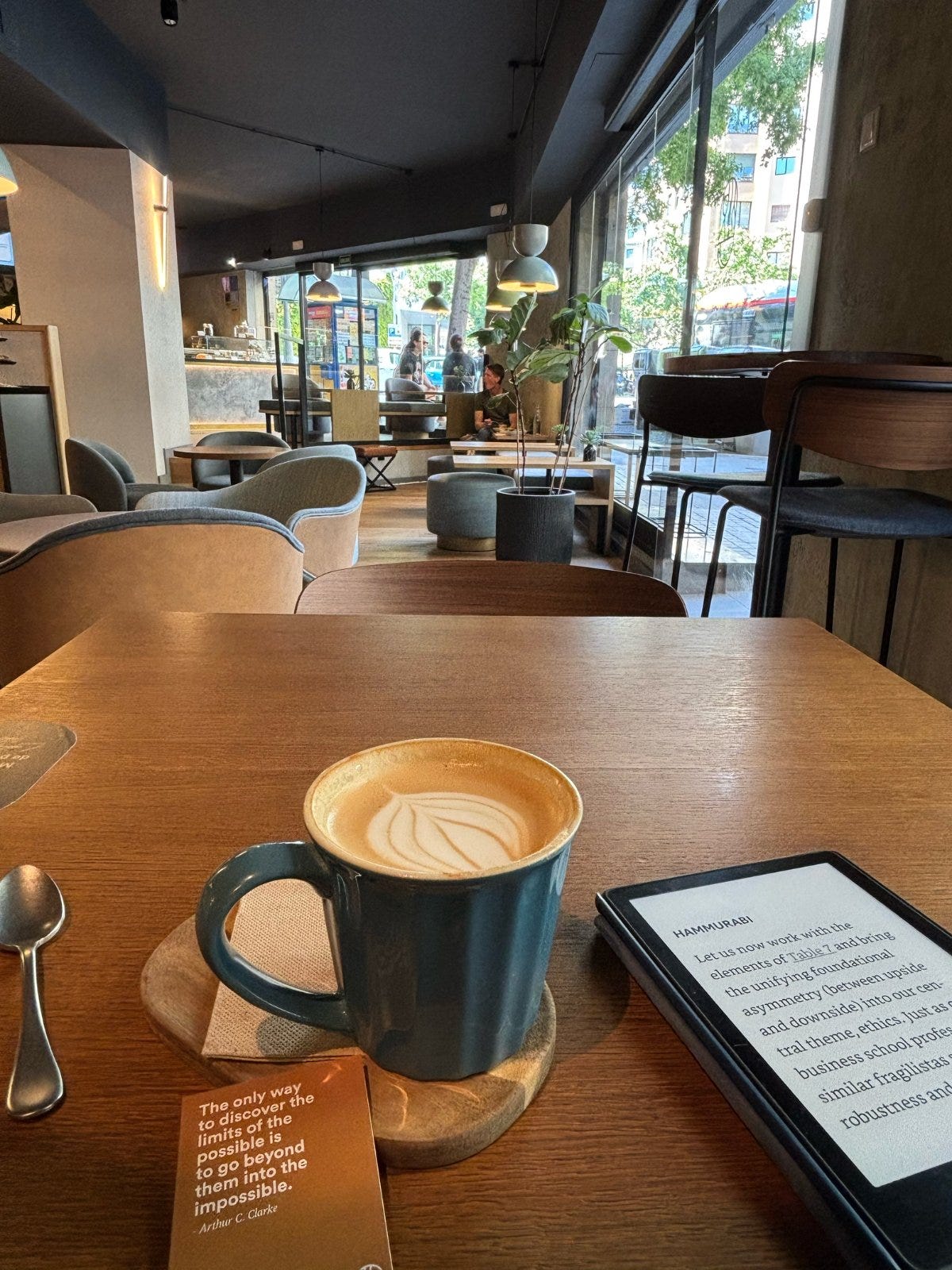 drinking a latte at SAGA Coffee Stories
