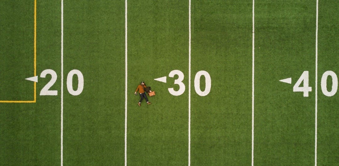 man lying on 30 yards on football field man lying on 30 yards on football field