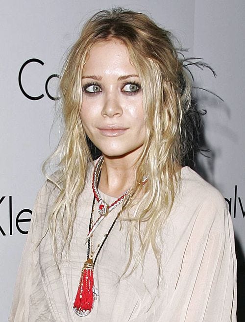 Mary Kate Olsen in layered snake collar and tassel necklace | Boho  hairstyles, Olsen fashion, Olsen twins style