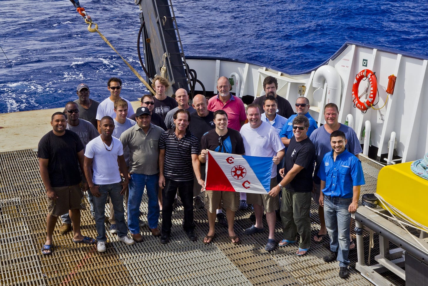 Group shot on Ocean Stalwart stern with The Explorers Club Flag Group shot on Ocean Stalwart stern with The Explorers Club Flag