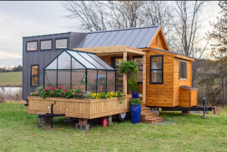 A picture containing grass, outdoor, tree, house

Description automatically generated