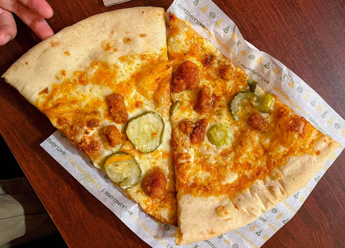 Two slices of Homer's Hot Chicken Odyssey on a plate