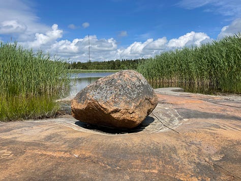 A lone rock in small cauldren, Åland; Lichen covered granite, close up on Åland; the water's edge all pebbles ans stones, Åland; A mountain of smooth stones, UK; wet, dark stones with one white quarz bit, Cornwall, UK; Piles of slate stone in St Nectan's Glen, Cornwall, UK