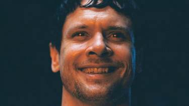 A close-up of a person smiling

AI-generated content may be incorrect.