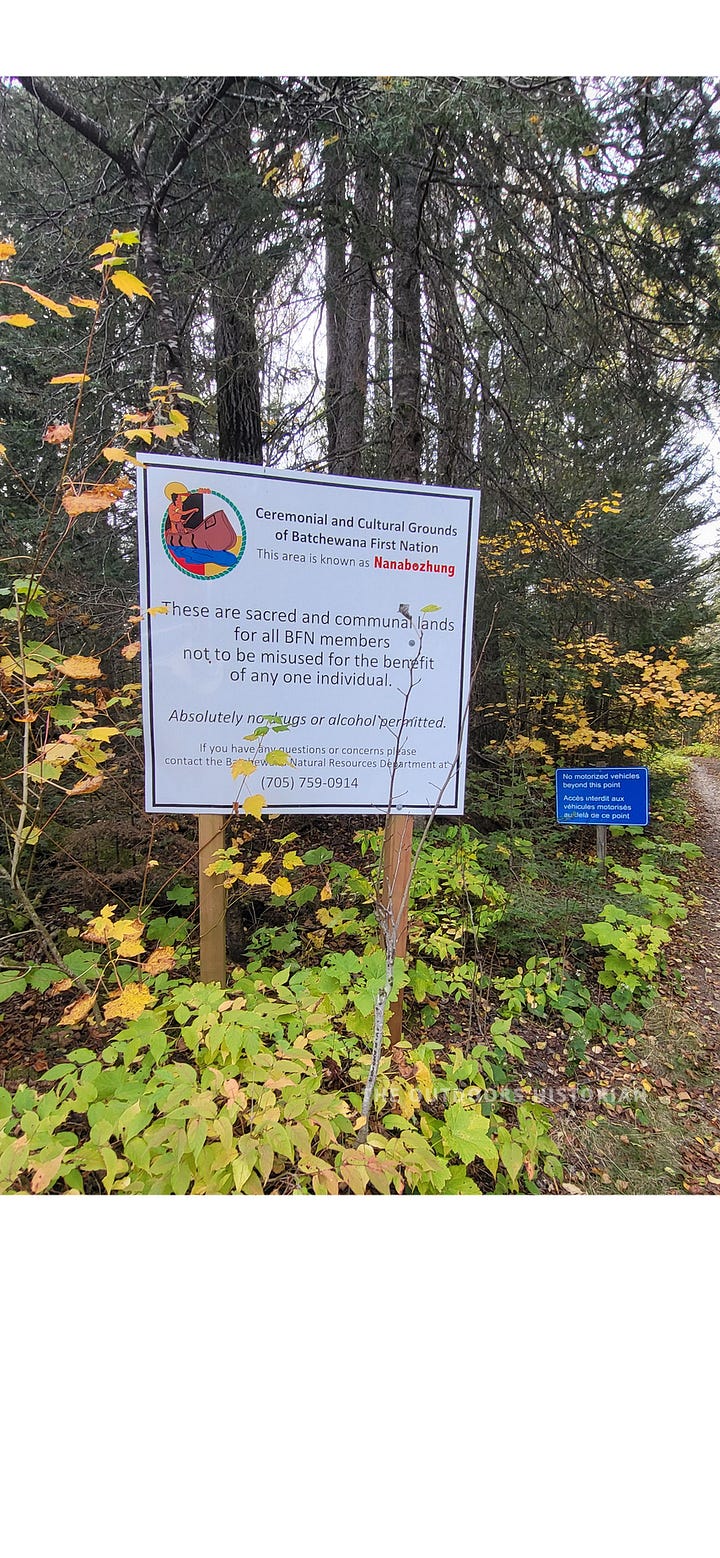 The first photo shows a new, brightly colored Batchewana First Nation sign.  The sign looks relatively new and stands in stark visual contrast to the older park sign. Blurry trees and a hint of the gravel path are visible in the background.  The second photo shows  a weathered, brown Ontario Parks sign at the Gargantua trailhead. The sign looks worn.