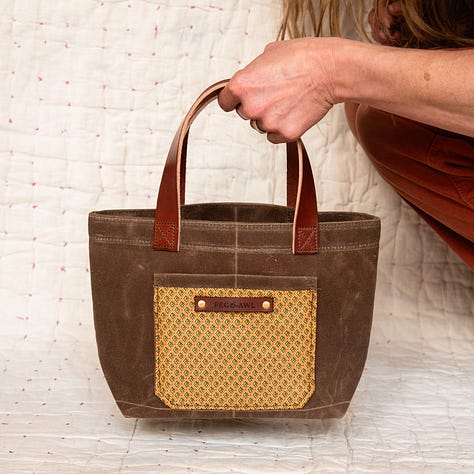 waxed canvas tote with vegetable tanned leather and antique textiles