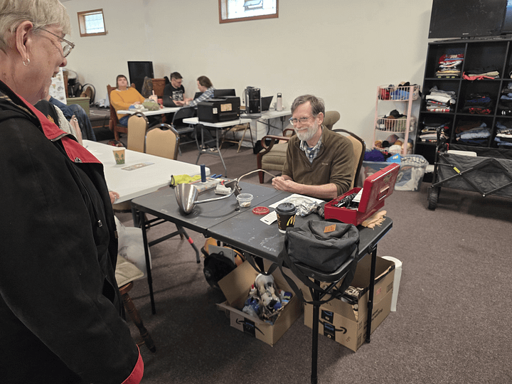 Images of people repairing items, including sewing jeans and repairing an old clock