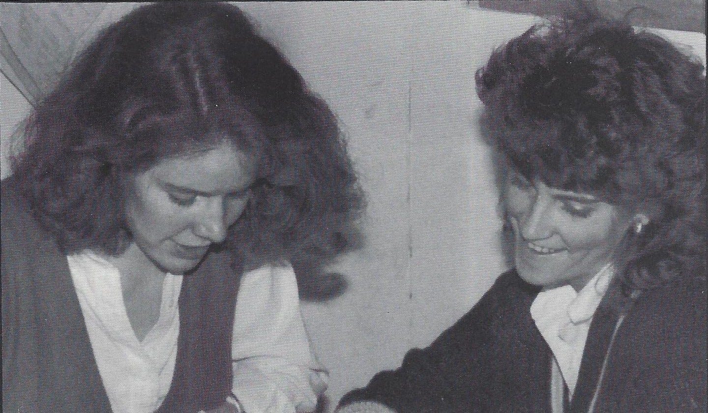 Black and white yearbook photo of two young women editors discussing that week's edition Black and white yearbook photo of two young women editors discussing that week's edition
