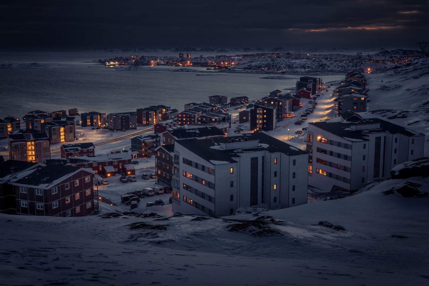 A winter night view from Qinngorput towards Nuuk in Greenland. By Mads Pihl
