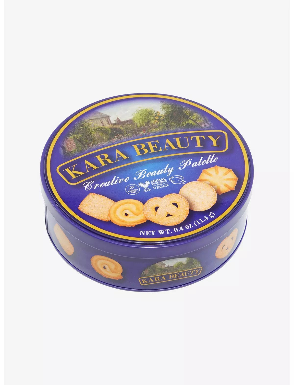 A blue tin of what looks like Danish cookies that everyone’s grandmother stored buttons and sewing supplies in. It shows butter cookies on the top but instead of the usual brand logo, it says Kara Beauty: Creative Beauty Palette.”