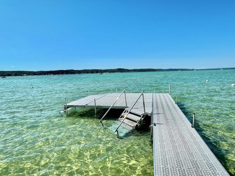 Torch Lake Waterfront Wonder--crystal clear water & shallow sandy walk-out - Rapid City | Stayz