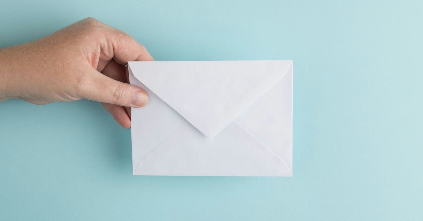 person showing white envelope person showing white envelope