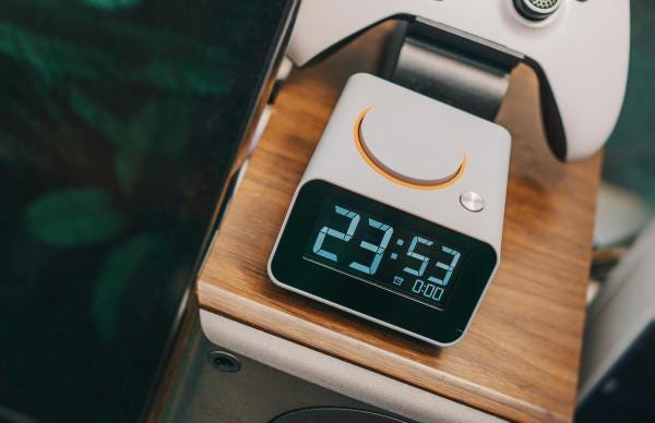 An alarm clock displaying 23h53 An alarm clock displaying 23h53