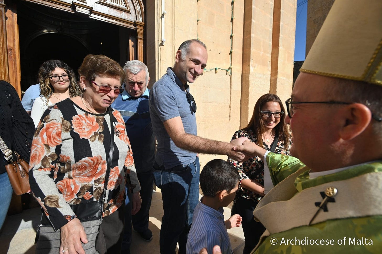 May be an image of one or more people, the Basilica of the National Shrine of the Immaculate Conception, the Western Wall and text that says "国田蛋計 © Archdiocese ArchdioceseofMalta of Malta"