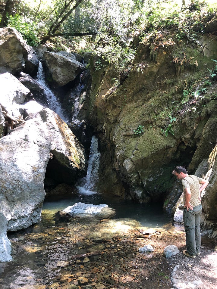 Abby looking out from balcony, Guion at waterfall