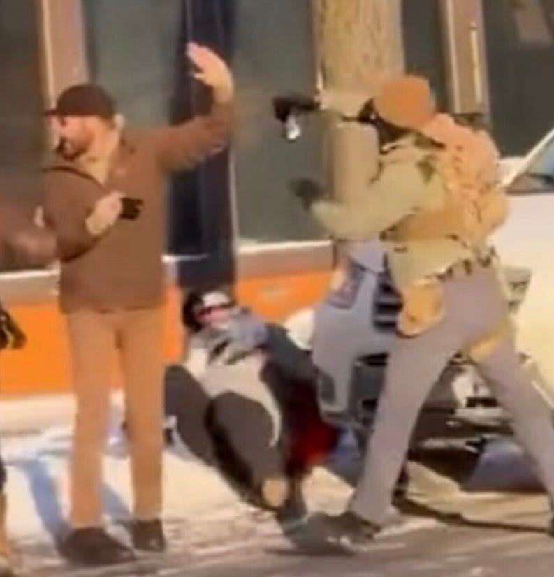 May be an image of standing, shovel, snowsuit and text