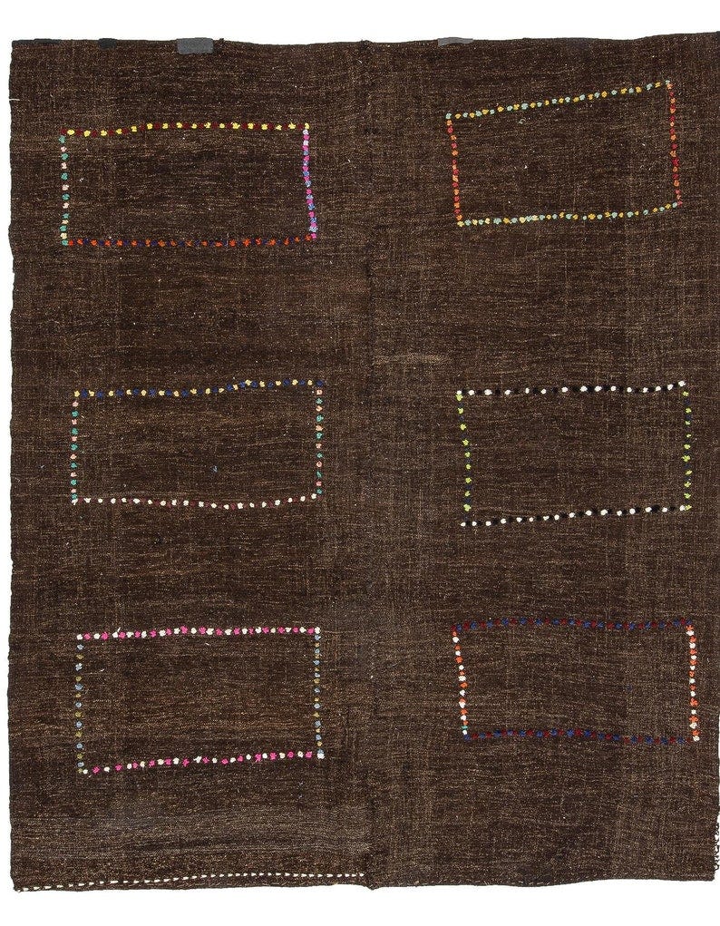 May include: A brown rug with six rectangular frames outlined in colorful stitching. The frames are evenly spaced across the rug.