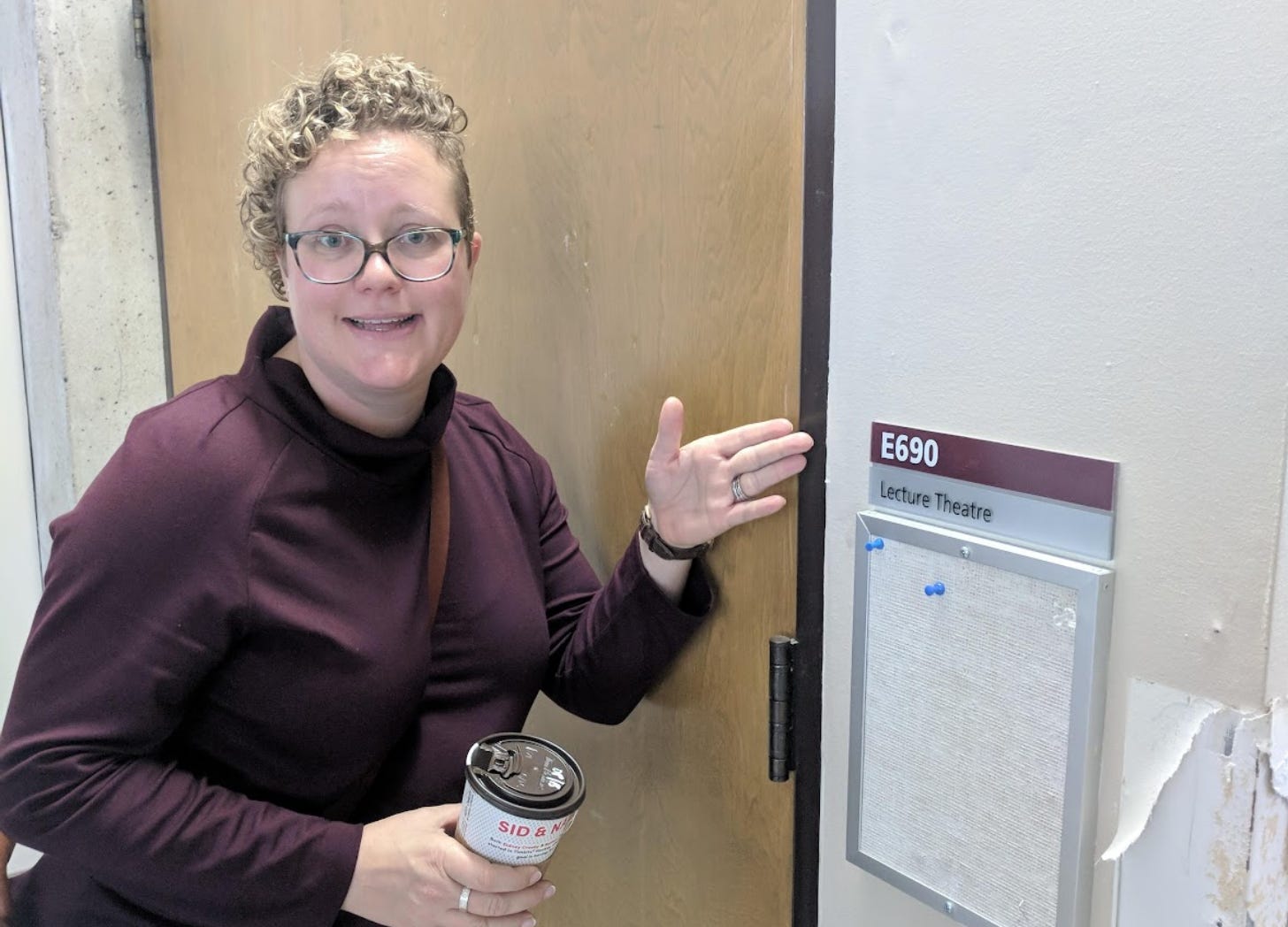 Standing outside the University of Lethbridge lecture hall where I first discovered computer science, 15 years later after being inducted into the Honour Society.