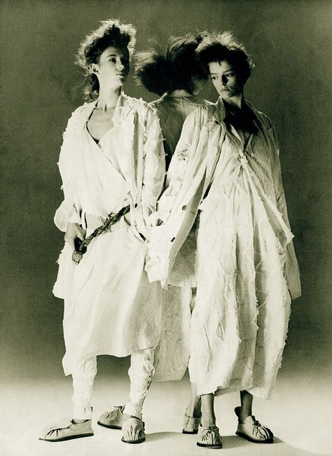 Top row, left to right: Yohji Yamamoto Fall/Winter 1983, Fall/Winter 2016, and an editorial look echoing his sculptural tailoring. Bottom row, left to right: Yamamoto in portrait (c. 1980s), Spring/Summer 1999 (wabi-sabi torn linen), and Spring/Summer 2023 (cage crinoline gown); Together, these works reflect Yamamoto’s enduring focus on asymmetry, restraint, and the poetic tension between structure and decay.
