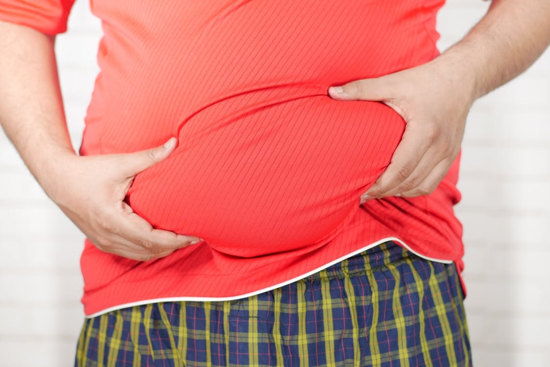 Free Close-up Photo of Person holding his Belly  Stock Photo
