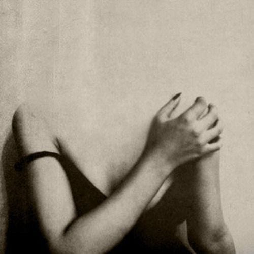 This may contain: a black and white photo of a woman with her hands on her face, leaning against a wall This may contain: a black and white photo of a woman with her hands on her face, leaning against a wall