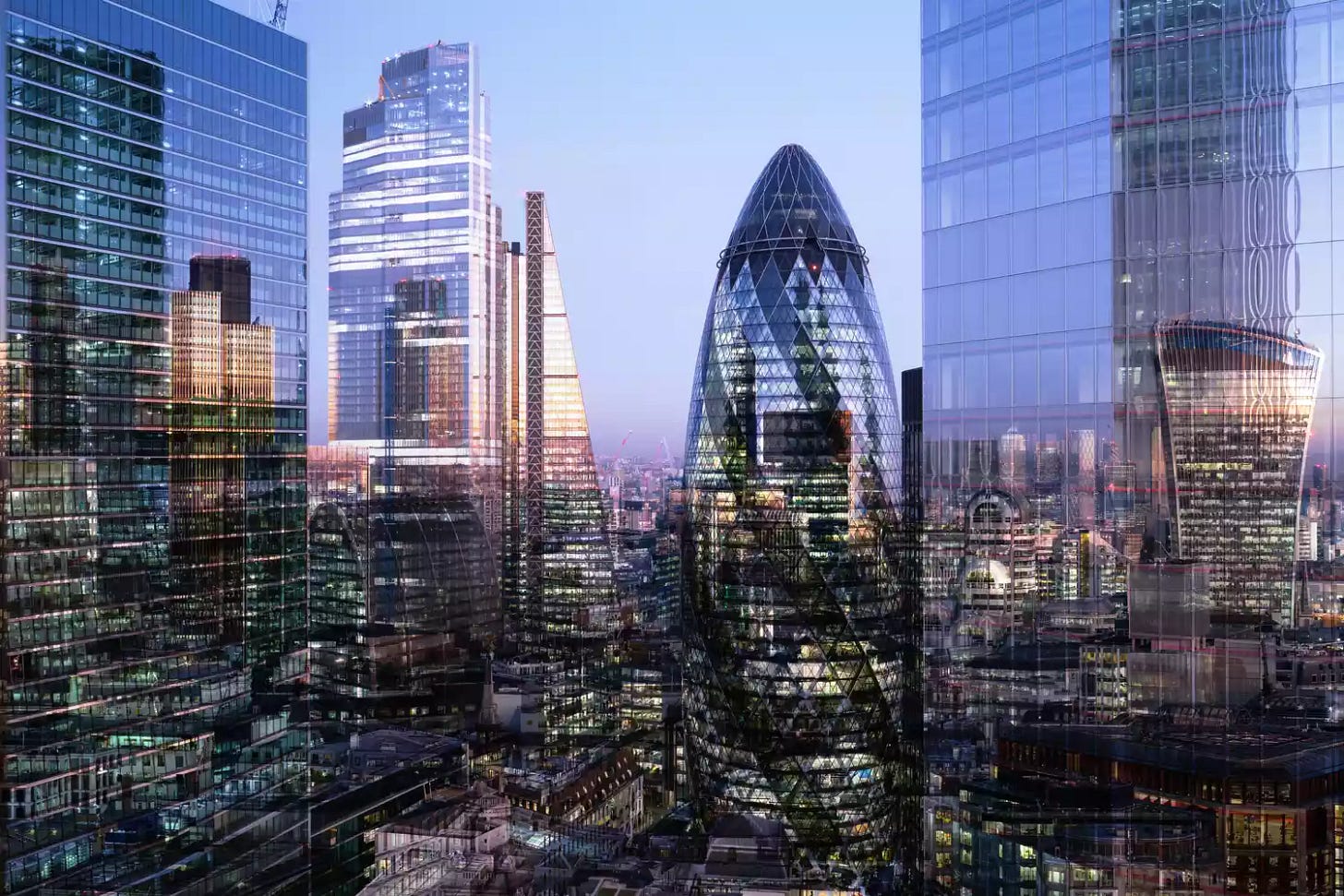 U.K., London, multiple-exposure, elevated view of high-rise financial buildings in the city, illuminated at dusk