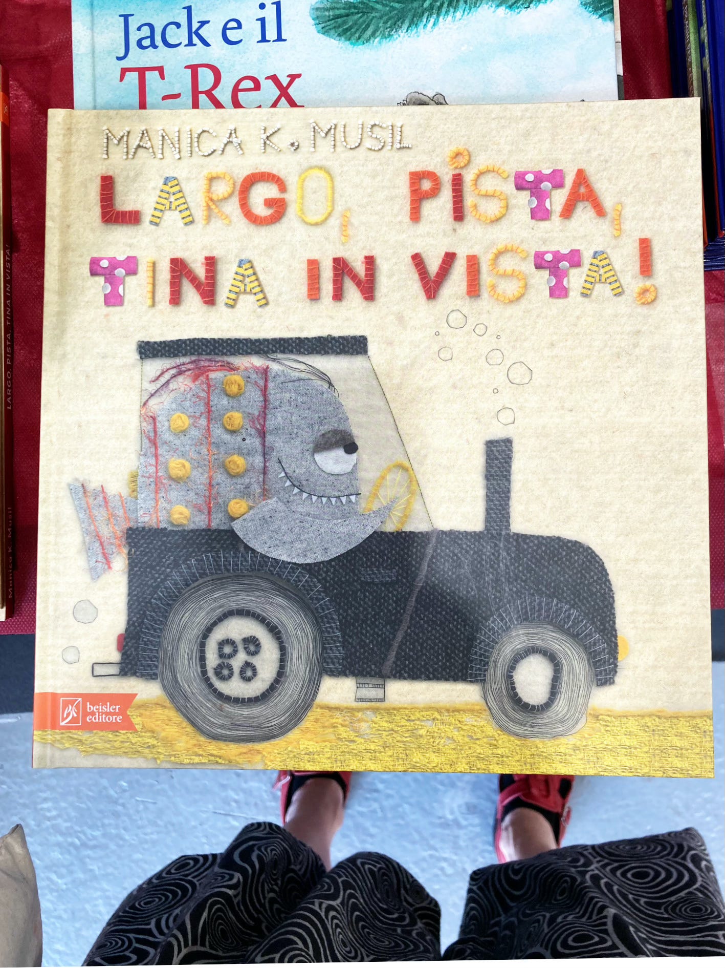 A photograph of the picture book 'Largo, Pista, Tina in Vista' by Manica K. Musil