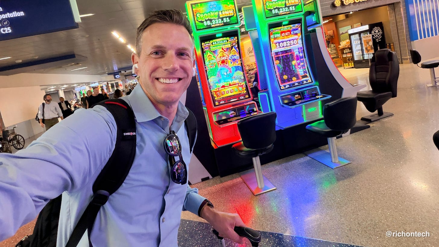 Rich DeMuro takes a selfie while walking through a Las Vegas airport, with brightly lit slot machines in the background. Rich DeMuro takes a selfie while walking through a Las Vegas airport, with brightly lit slot machines in the background.