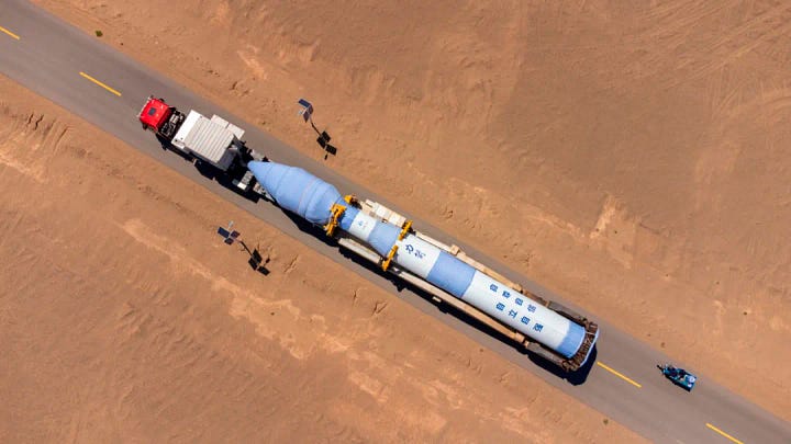 The Kinetica-1 Y10 vehicle being placed onto its transporter-erector (left) and being brought to its launch pad (right).