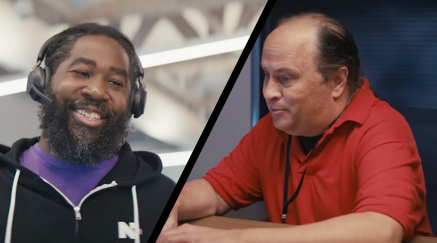Scene from Be able campaign video of an “N-abler” speaking with an IT professional.