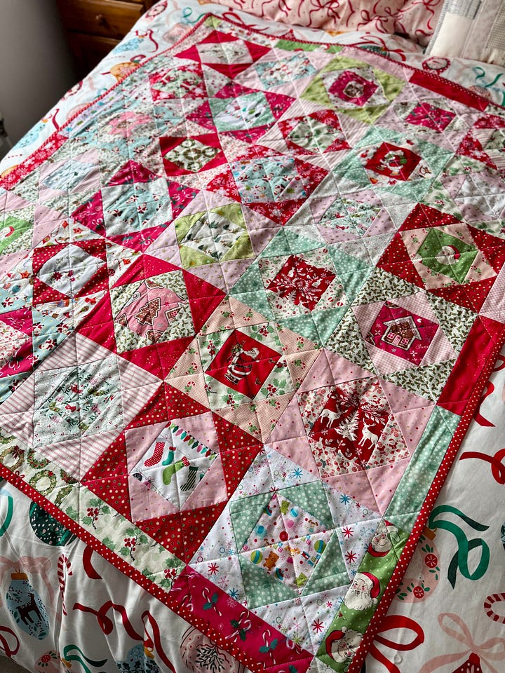 Handmade Christmas quilt in bright, merry fabrics!