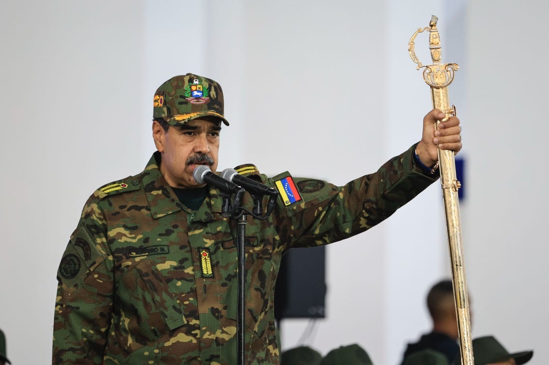 A person in military uniform holding a gold sword

AI-generated content may be incorrect.