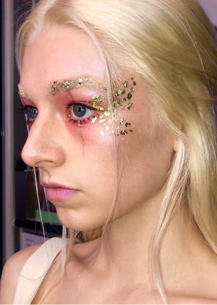 Hunter Schafer as Jules in Euphoria Season 1 wearing the iconic gold foil and ethereal glitter makeup look by Donni Davy. Hunter Schafer as Jules in Euphoria Season 1 wearing the iconic gold foil and ethereal glitter makeup look by Donni Davy.