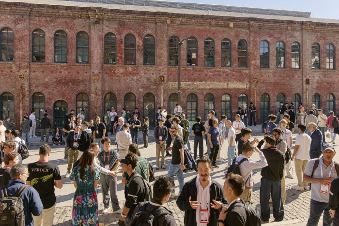 Investors and startup founders mingling outdoors at Y Combinator Demo Day. Investors and startup founders mingling outdoors at Y Combinator Demo Day.