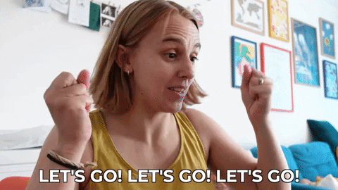 Hannah excitedly shaking her fists and saying, "Let's go, let's go, let's go!"