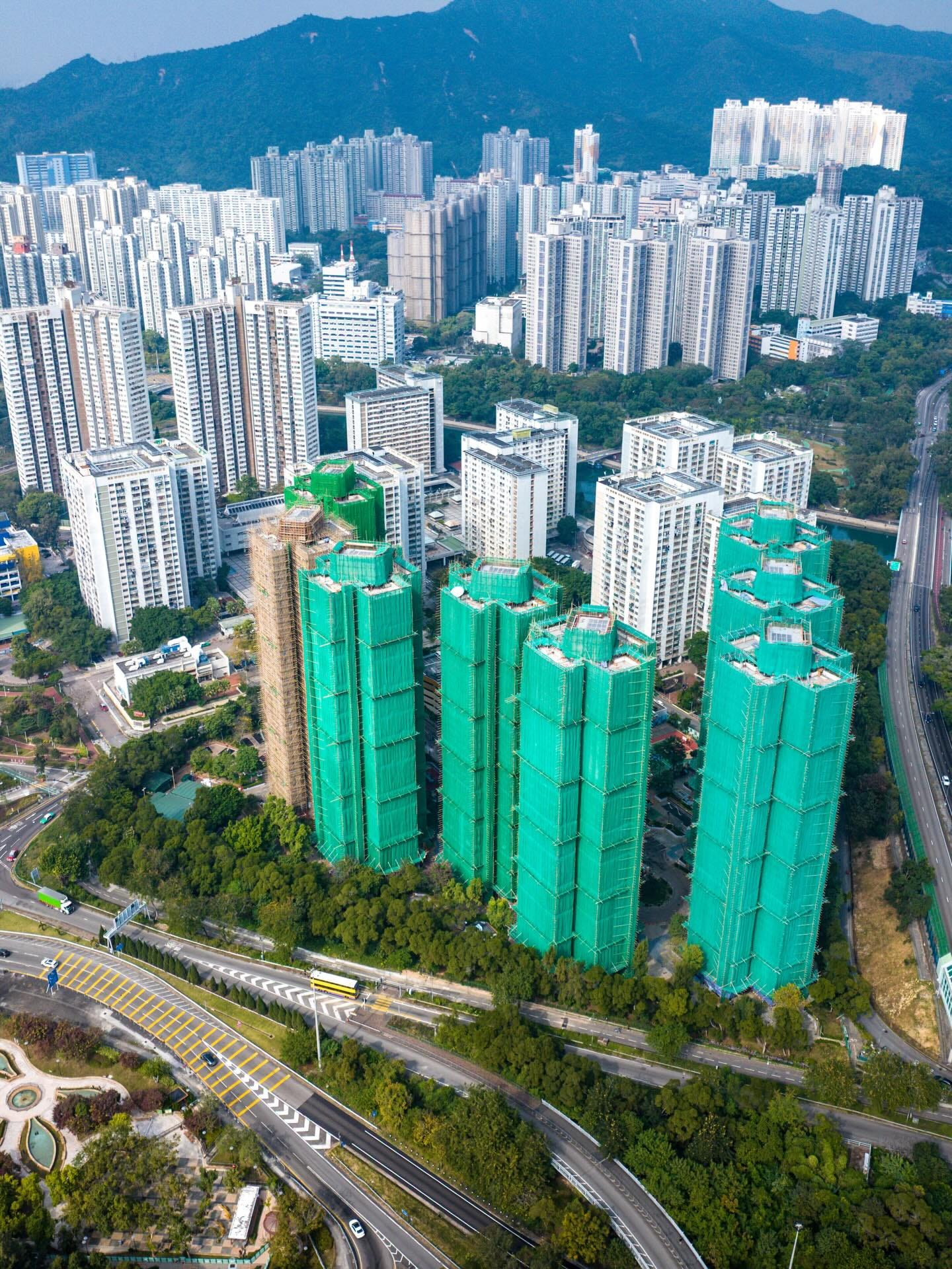 May be an image of skyscraper, road, Victoria Peak, tower, buildings and text