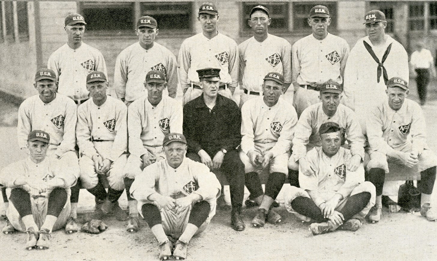 The 1918 Great Lakes baseball team included three players who started on the football team as well. Outfielder George Halas stands second from left. Pitcher Jerry Jones stands third from right and infielder Paddy Driscoll is seated on the far left. (Great Lakes Recruit, July 1918) The 1918 Great Lakes baseball team included three players who started on the football team as well. Outfielder George Halas stands second from left. Pitcher Jerry Jones stands third from right and infielder Paddy Driscoll is seated on the far left. (Great Lakes Recruit, July 1918)