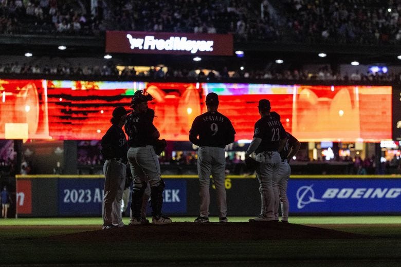 Fans may have been slightly thrown off by the introduction of reliever Andres Munoz in the seventh. Lights were turned off and emergency lights flashed on the screen as a member of the Los Bomberos, aka the Mariners bullpen, entered the game. The Washington Nationals played the Seattle Mariners in Major League Baseball Tuesday at T-Mobile Park, in Seattle. (Dean Rutz / The Seattle Times)