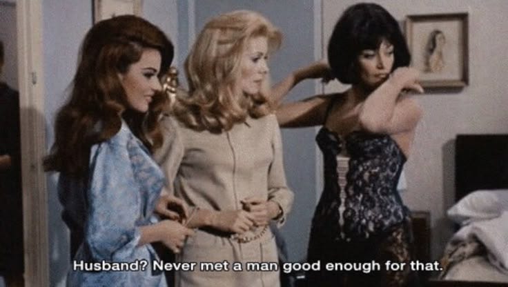 This may contain: three women standing in a bedroom talking to each other with the caption husband never met a man good enough for that