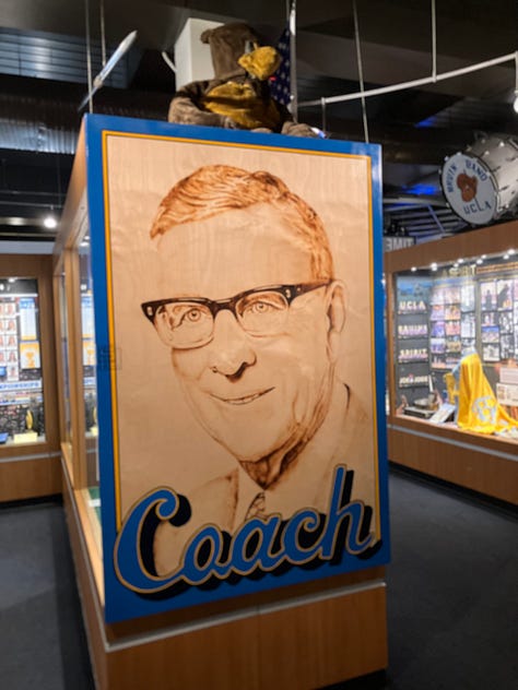 Images of John Wooden, his den, trophies, and author standing by the John Wooden monument