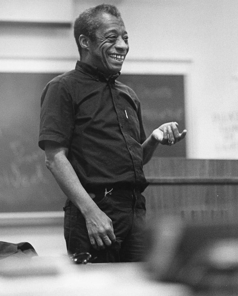 James Baldwin standing in front of a classroom at Bowling Green State University, 1978-1979.